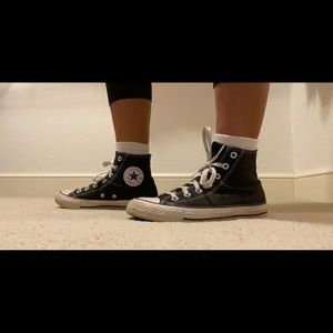 Used pair of black converse high tops